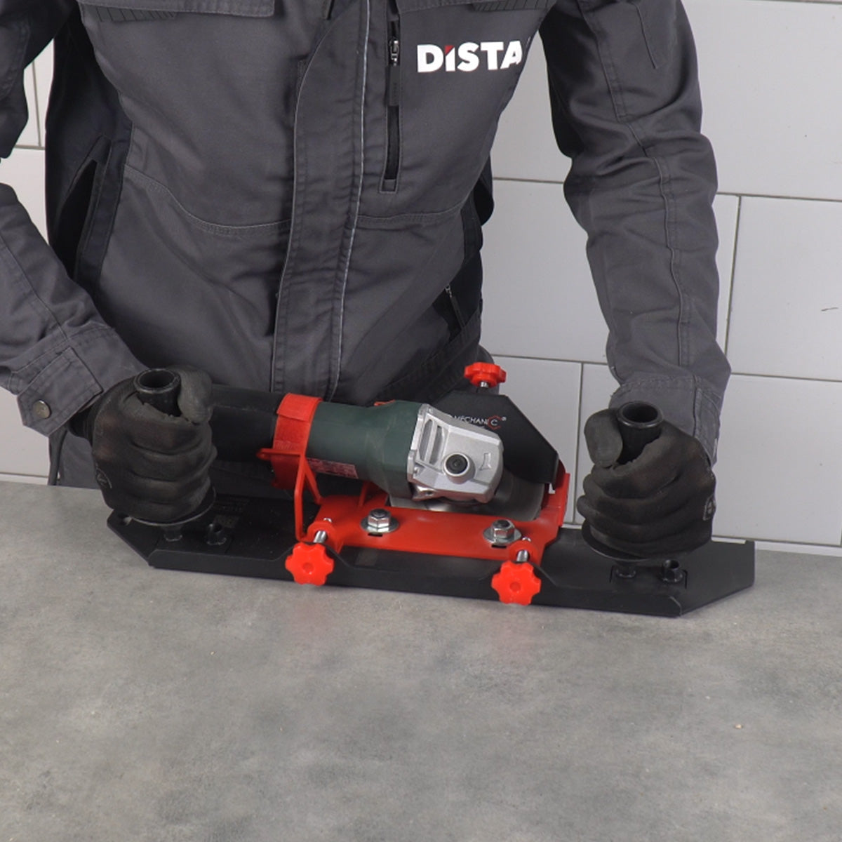 Professional contractor in Distar workwear operating the Mechanic SLIDER 45 PRO 2.0 miter cutting guide on porcelain tile